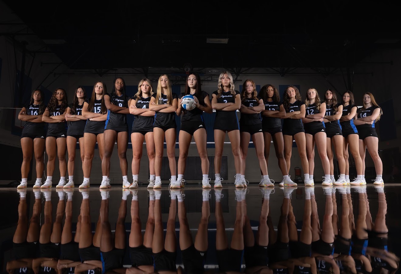 Byron Nelson Volleyball team standing together on the court